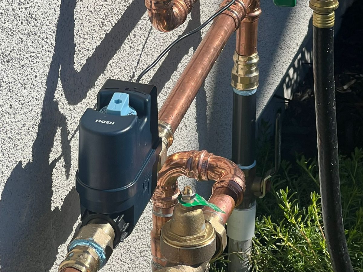 Copper main water line with a new pressure regulator and shut-off valve
