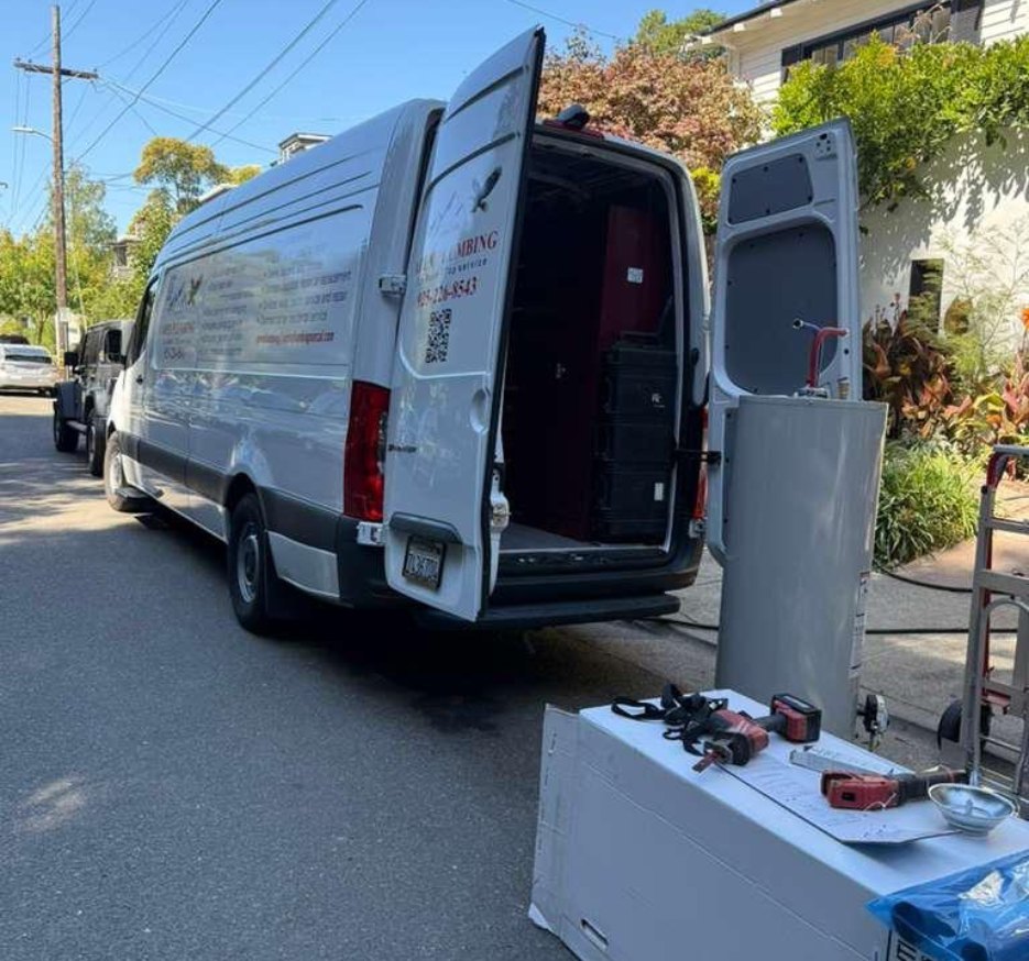 Apex Plumbing van parked at a job with the rear doors open